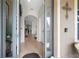 Welcoming entryway with tiled floors and arched doorway showcasing the home's interior at 19528 Sunset Bay Dr, Land O Lakes, FL 34638