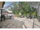 Expansive screened patio featuring brick flooring, outdoor furniture, and relaxing place at 19528 Sunset Bay Dr, Land O Lakes, FL 34638