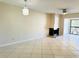 Bright living room with tile flooring, fireplace, and ceiling fan at 2024 Blue Hawk Ct # 1822, Clearwater, FL 33762