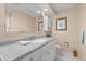 Bathroom with a single sink vanity, neutral countertops, and framed mirror above at 2060 Attache Ct, Clearwater, FL 33764