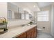 Bathroom features a large vanity, ample mirrors, and a toilet at 2060 Attache Ct, Clearwater, FL 33764