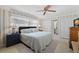 Bright bedroom featuring wallpaper, natural light and a comfortable bed at 2060 Attache Ct, Clearwater, FL 33764
