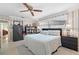 Bright bedroom featuring wallpaper, natural light and a comfortable bed at 2060 Attache Ct, Clearwater, FL 33764