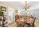 Warm dining room with traditional furnishings, adjacent to the kitchen and living area at 2060 Attache Ct, Clearwater, FL 33764
