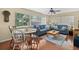 Cozy living area with comfortable seating and large windows, creating a relaxed atmosphere at 2060 Attache Ct, Clearwater, FL 33764