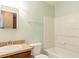 Cozy bathroom with a shower/tub and single sink vanity with neutral paint at 2453 Edgewater Falls Dr, Brandon, FL 33511