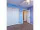 A secondary bedroom with carpeted floors, closet, and neutral paint at 2453 Edgewater Falls Dr, Brandon, FL 33511