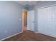 A secondary bedroom with carpeted floors, closet, and neutral paint at 2453 Edgewater Falls Dr, Brandon, FL 33511