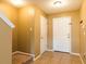 Entryway with tile flooring, staircase, and neutral paint at 2453 Edgewater Falls Dr, Brandon, FL 33511