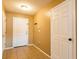 Bright entryway with tile floors, white doors, and neutral-toned walls, offering a welcoming transition at 2453 Edgewater Falls Dr, Brandon, FL 33511
