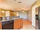Kitchen includes stainless steel dual sink and black dishwasher at 2453 Edgewater Falls Dr, Brandon, FL 33511