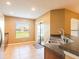 The kitchen features a stainless steel sink and a pass-through bar to the dining area, optimizing space at 2453 Edgewater Falls Dr, Brandon, FL 33511