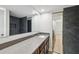 Modern bathroom featuring a sleek vanity, large mirror, and a beautifully tiled walk-in shower at 2722 11Th Ct # 50A, Palm Harbor, FL 34684