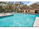 Community pool with ample seating and clubhouse, perfect for relaxation and socializing at 2722 11Th Ct # 50A, Palm Harbor, FL 34684