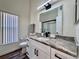 Bathroom with granite counters, modern fixtures, and shower at 2752 Cypress Dr, Clearwater, FL 33763