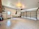 Spacious two-car garage featuring sealed floors, utility sink, and ample storage space, providing convenience and functionality at 2752 Cypress Dr, Clearwater, FL 33763