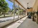Large screened lanai features a ceiling fan and view to backyard at 2752 Cypress Dr, Clearwater, FL 33763