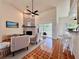 Inviting living room featuring a cozy fireplace, sliding glass doors to the outside, and a breakfast bar at 2752 Cypress Dr, Clearwater, FL 33763