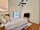 Bright main bedroom boasts large windows and a ceiling fan for comfort at 2752 Cypress Dr, Clearwater, FL 33763