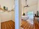 Walk-in closet with shelves and hanging space adjacent to a main bedroom at 2752 Cypress Dr, Clearwater, FL 33763