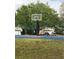 Community basketball court for residents to enjoy with lush green surroundings at 3314 Pine Top Dr, Valrico, FL 33594