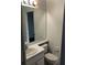 Bathroom featuring white vanity and a large mirror at 3314 Pine Top Dr, Valrico, FL 33594