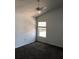 Neutral bedroom features carpet flooring, a window, and a ceiling fan at 3314 Pine Top Dr, Valrico, FL 33594
