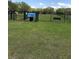 Fenced dog park with green space, bench, and posted rules for community enjoyment and pet-friendly living at 3314 Pine Top Dr, Valrico, FL 33594