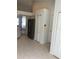 This kitchen has white walls, cabinets, stainless refrigerator and tile flooring at 3314 Pine Top Dr, Valrico, FL 33594