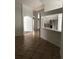 Open concept with view of the kitchen featuring white cabinets and stainless appliances at 3314 Pine Top Dr, Valrico, FL 33594
