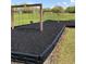 Community playground featuring swings, a safety mulch surface, and a grassy field at 3314 Pine Top Dr, Valrico, FL 33594