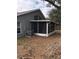 View of the screened in porch with white trim and neutral exterior at 3314 Pine Top Dr, Valrico, FL 33594