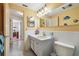 Well-lit bathroom with a vanity and tiled walls, showcasing a clean and functional space at 3349 Clydesdale Dr, Holiday, FL 34691