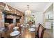 Elegant dining room with a decorative fireplace and seating for the whole Gathering at 3349 Clydesdale Dr, Holiday, FL 34691