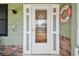 Charming front door adorned with nautical decor and a welcoming vibe at 3349 Clydesdale Dr, Holiday, FL 34691