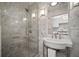 Modern bathroom with a glass-enclosed shower, stylish sink, and elegant tile work at 3906 W De Leon St, Tampa, FL 33609