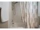 This bright bathroom features a shower-tub and tile accents at 3906 W De Leon St, Tampa, FL 33609