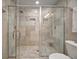 Large walk-in shower with dual shower heads and neutral tile, plus a comfort-height toilet at 3906 W De Leon St, Tampa, FL 33609