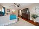 Spacious bedroom with hardwood floors and natural light, featuring an ensuite bathroom and walk-in closet at 3906 W De Leon St, Tampa, FL 33609