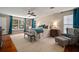 Bright bedroom with hardwood floors, sitting area, large windows, and stylish decor at 3906 W De Leon St, Tampa, FL 33609