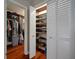 Organized closet with white louvered doors, shelving and a wood floor at 3906 W De Leon St, Tampa, FL 33609