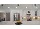Bright kitchen features stainless steel appliances and white cabinets with a large island at 3906 W De Leon St, Tampa, FL 33609