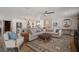 Open-concept living room flows into the kitchen, featuring a large sectional sofa and stylish decor at 3906 W De Leon St, Tampa, FL 33609
