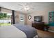 Comfortable main bedroom with ample natural light, stylish furnishings, and serene ambiance at 3906 W De Leon St, Tampa, FL 33609