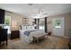 Bright main bedroom featuring a comfortable bed, ample natural light, and stylish decor at 3906 W De Leon St, Tampa, FL 33609