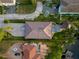 An aerial view showcasing the house's layout, roof, and surrounding landscape, with a focus on privacy at 3924 N Ridge Ave, Tampa, FL 33603