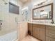 Bathroom showcasing a walk-in shower, granite countertops, and modern fixtures at 3924 N Ridge Ave, Tampa, FL 33603