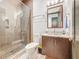 This is a full bathroom with modern design elements and a walk in shower at 3924 N Ridge Ave, Tampa, FL 33603