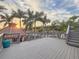 Scenic outdoor deck with palm trees, leading to a charming gazebo overlooking the water at 3924 N Ridge Ave, Tampa, FL 33603