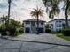Charming home with two-car garage, brick driveway, stairway and a palm tree at 3924 N Ridge Ave, Tampa, FL 33603